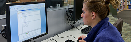 Female student working at computer