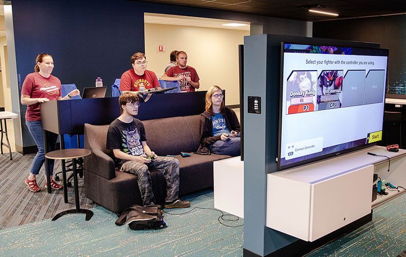 A side view of a row of students working on computers