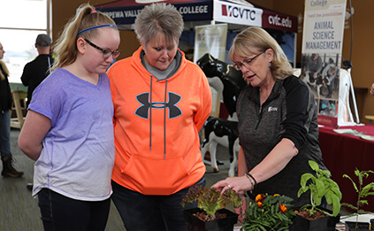 Student and Parent Talking with Instructor