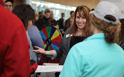 Marketing instructor talking to students