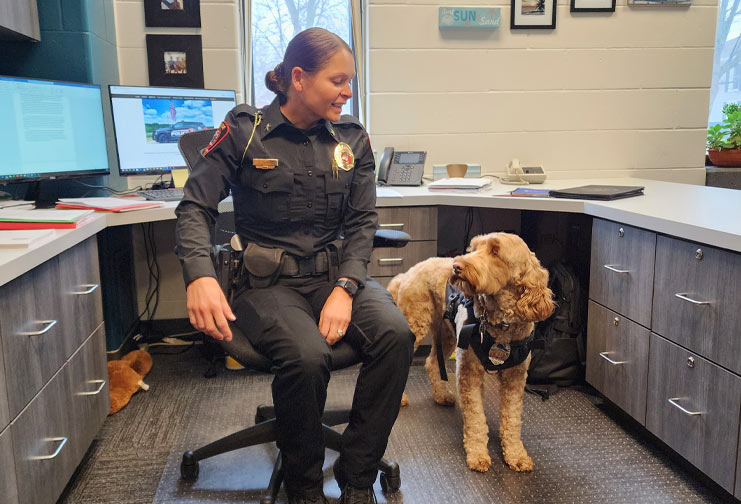 Female police chief with therapy dog