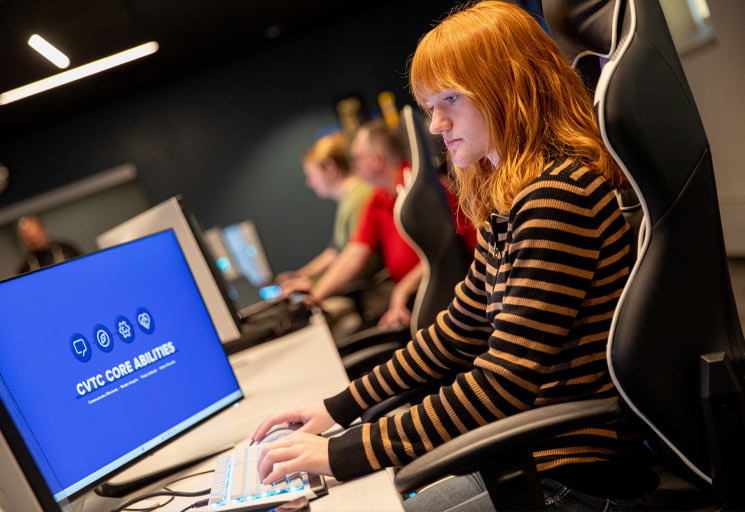 CVTC IT student at a computer in the cyber lab