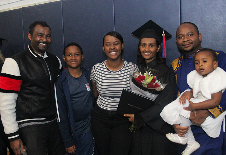 Student Graduate With Her Family