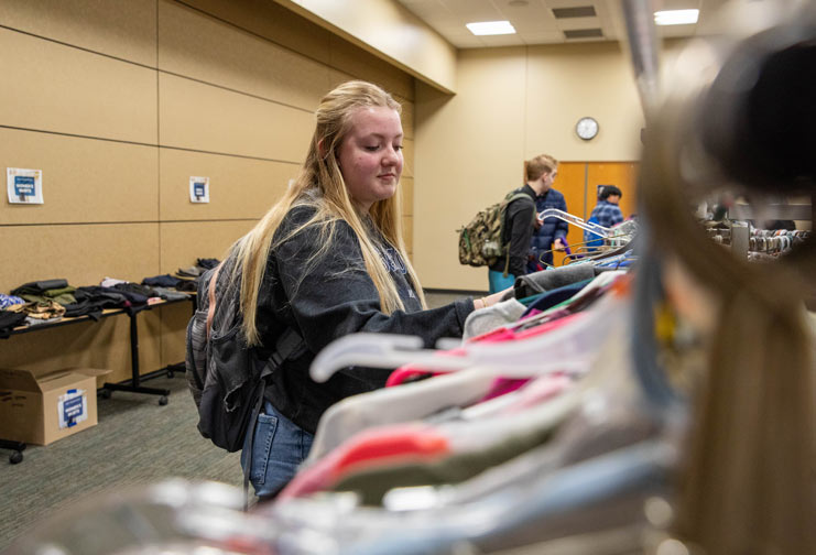 College student choosing clothes for career