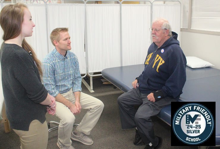 Veteran sitting on a health facility cot at a technical college