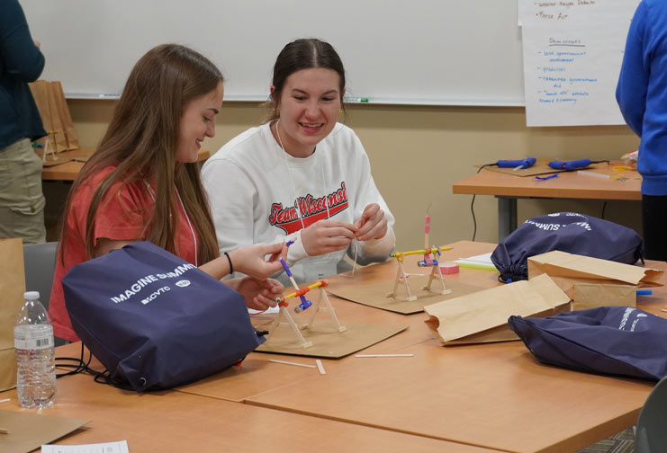 Two females practicing STEM