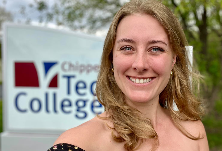 Female college student in front of CVTC sign