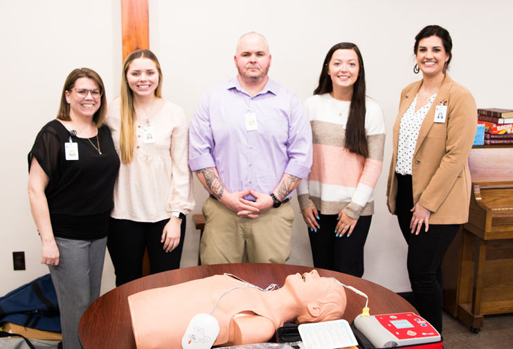 five nursing student posing for photo ready to teach hands-only CPR 