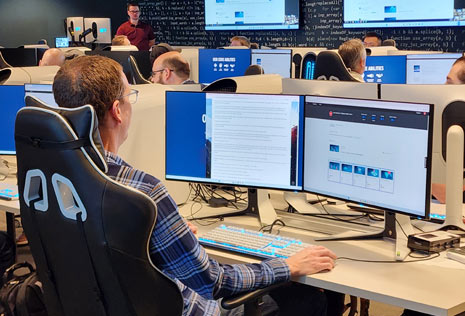 man at computer in cybersecurity lab