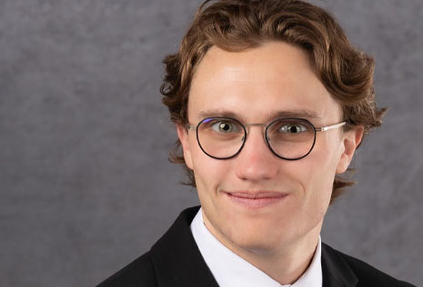 man with glasses in a suit
