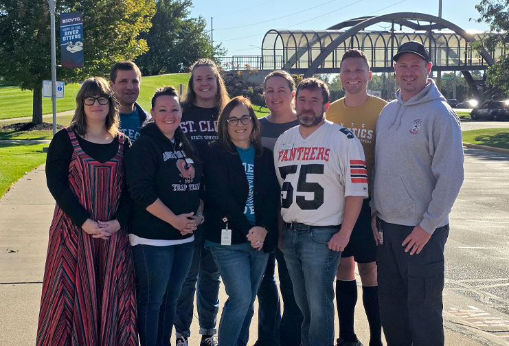 CVTC award winners outside by the bridge.
