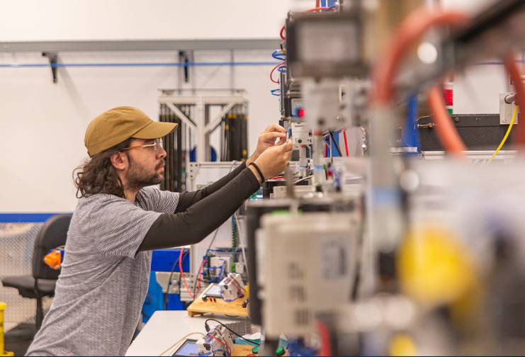 Man learning mechatronics at a technical college