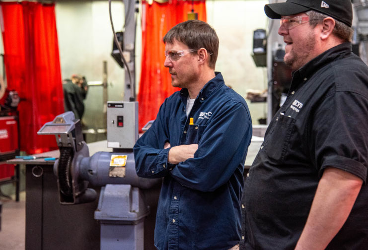 Two instructors in the welding lab at CVTC
