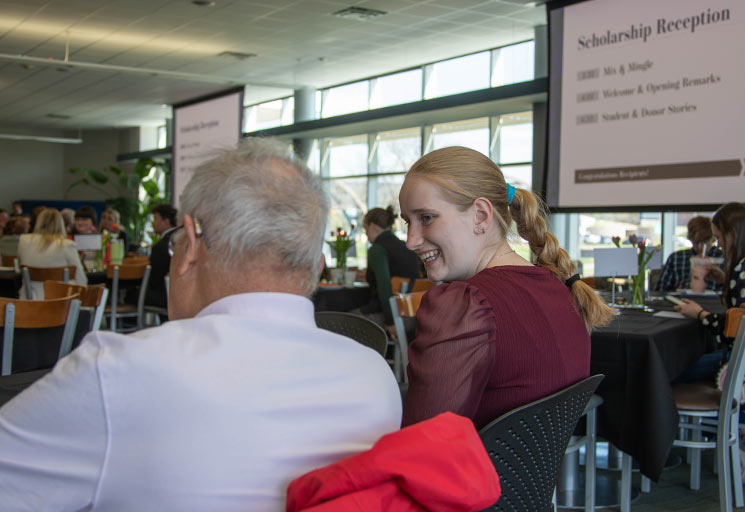 Female student and male donor at the scholarship reception at CVTC