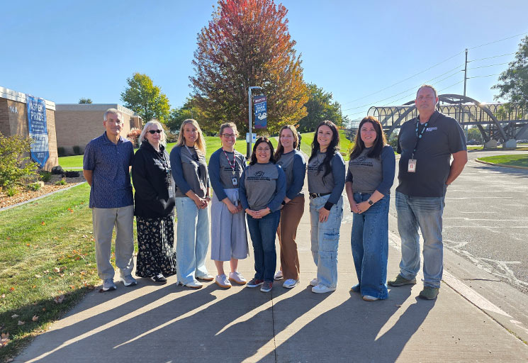 Colleagues at CVTC outside smiling, award winners